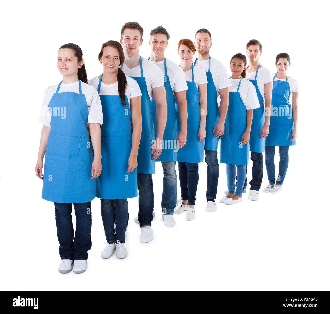 Large diverse group of cleaners or janitors standing in a queue in a