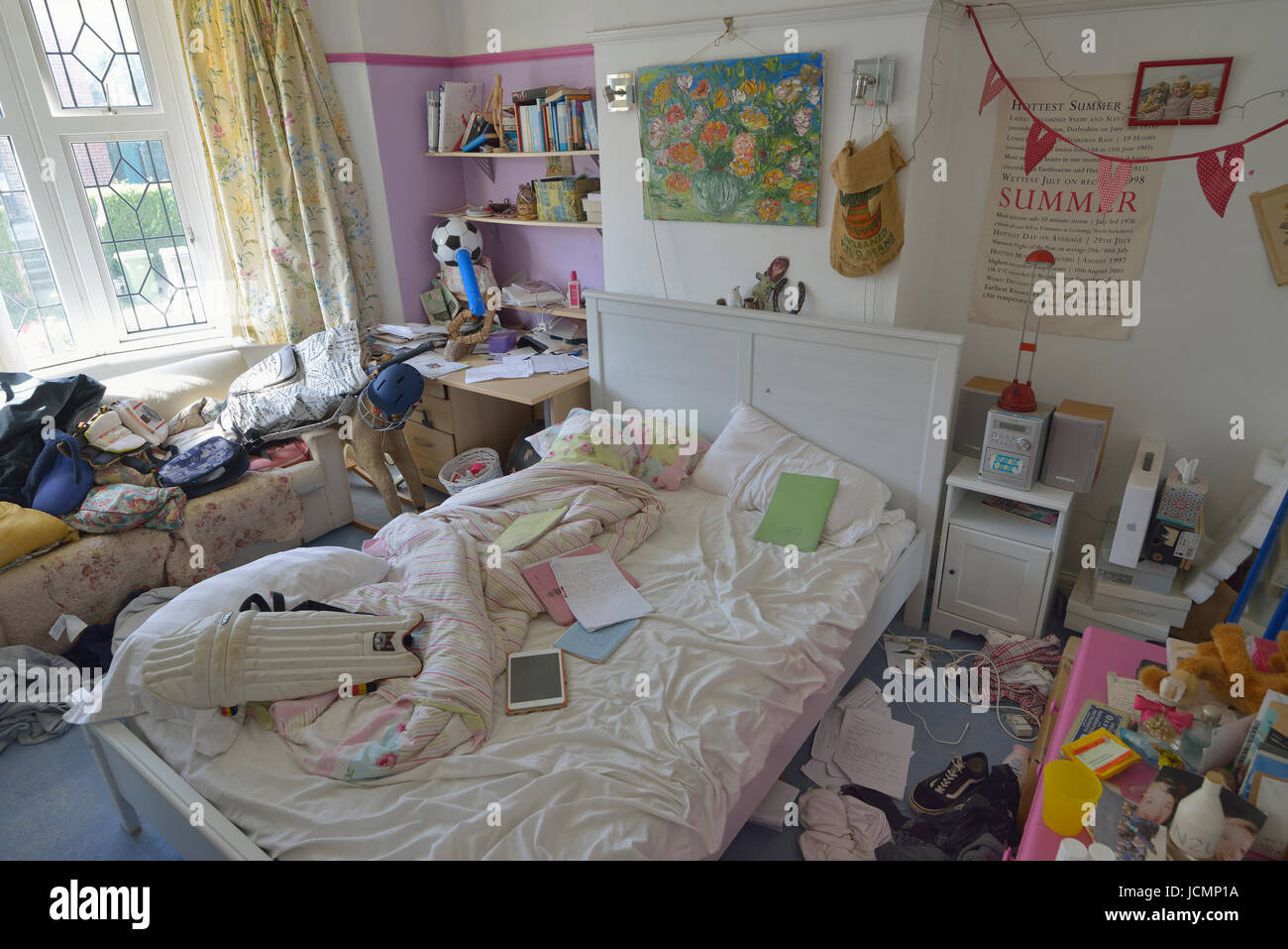 Untidy teenage boys bedroom. England. UK Stock Photo