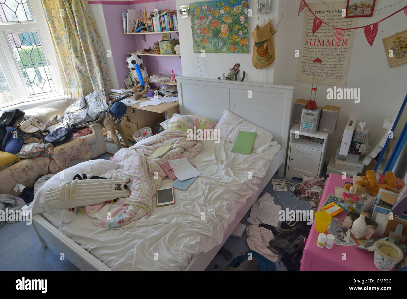 Untidy teenage boys bedroom. England. UK Stock Photo