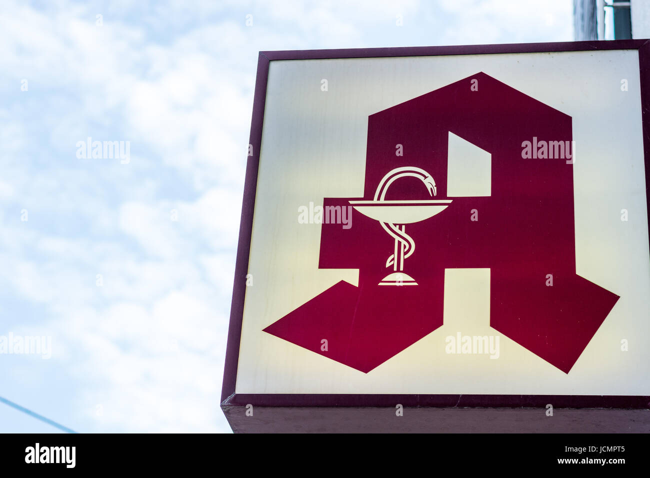 The German Red Sign For A Pharmacy In The Streets Stock Photo - Alamy