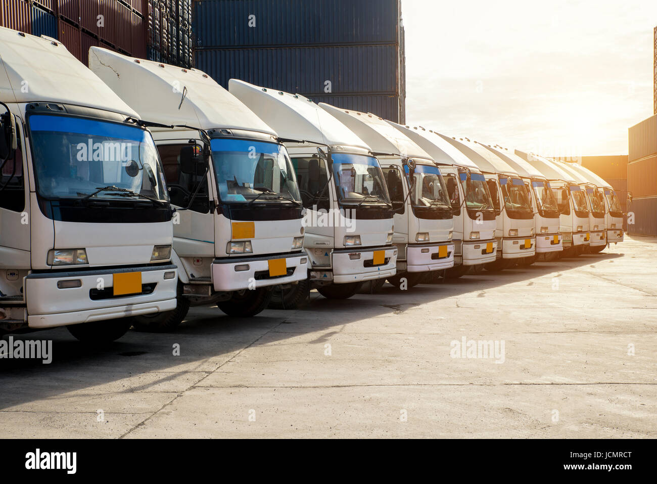 Container truck in depot at port. Logistics import export background and transport industry concept. Stock Photo