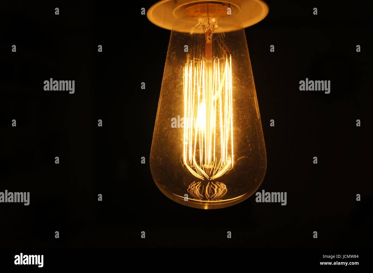 Exposed filament lightbulb Stock Photo Alamy