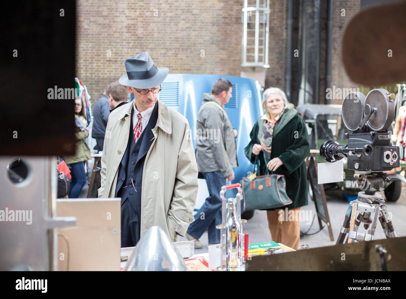 Man looks at signs at vintage fair in London. Stock Photo