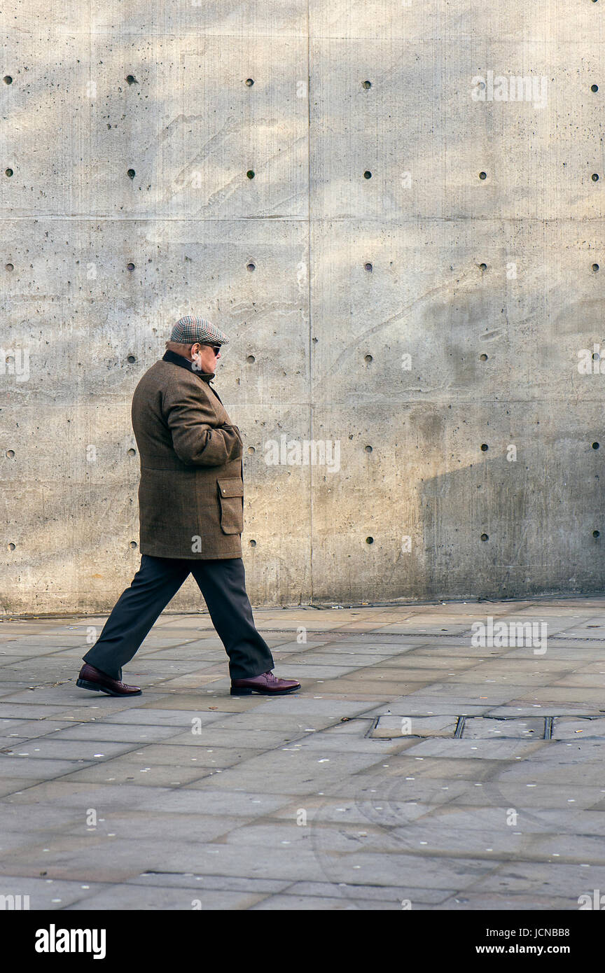 Old man walking in Manchester Stock Photo