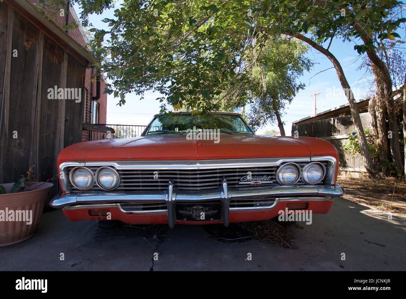 Red old car under a tree in Seligman, Arizona Stock Photo - Alamy