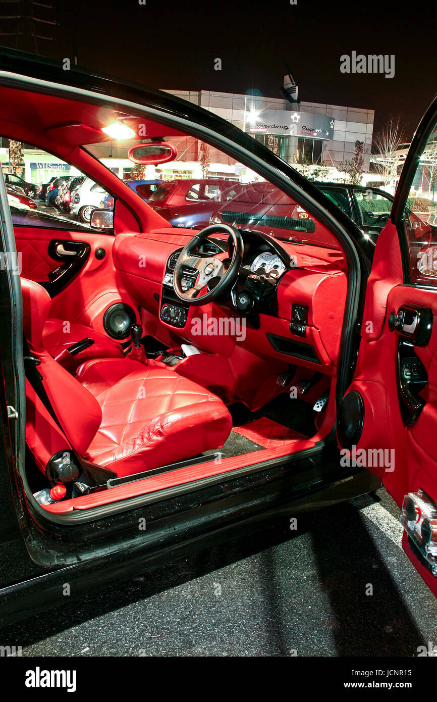 Well lit photo of car's red leather interior. Stock Photo