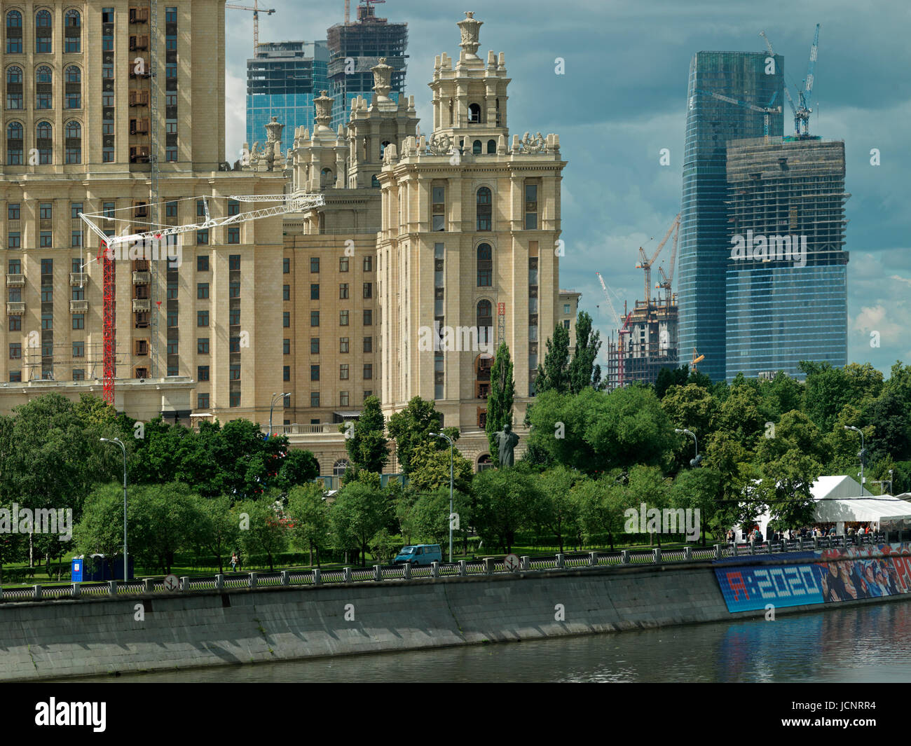 the Stalin building - Hotel Ukraina, one of the Seven Sisters buildings, river Moskva, background Moscow City. Moscow, Russia, Europe Stock Photo