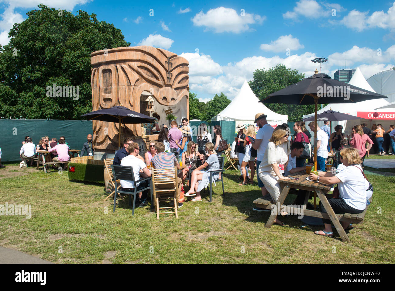 Regent Park, London, UK. 15th June 2017. Visitors at the Taste of London festival in Regent's Park, where London's top chefs show off their skills and serve up delicious food in the sunshine. Credit: Michael Tubi/Alamy Live News Stock Photo