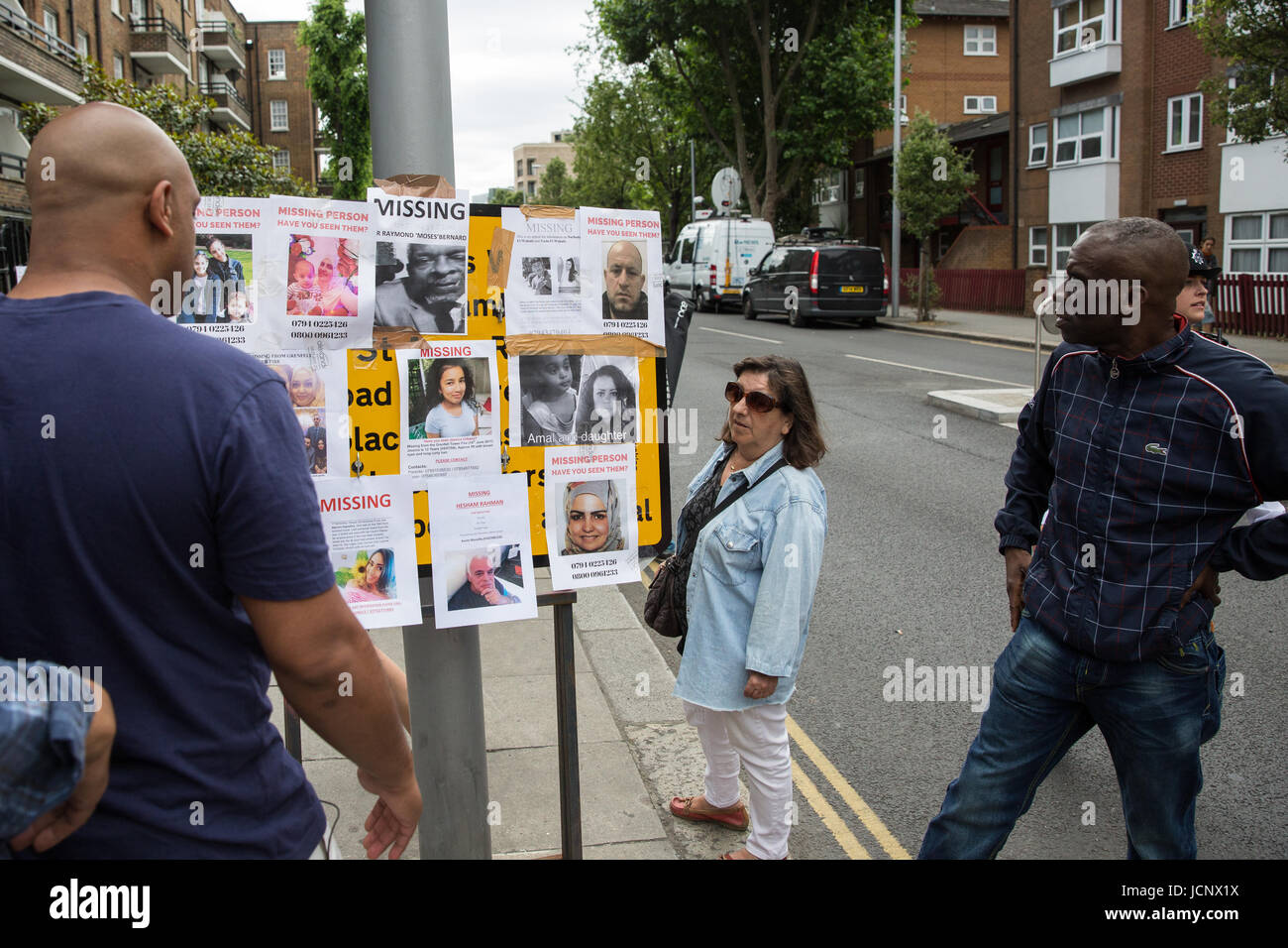 London, UK. 16th June, 2017. Local residents view missing person notices posted by family members and friends seeking help in tracing those still missing following the fire in the Grenfell Tower close to Latimer Road underground station. Credit: Mark Kerrison/Alamy Live News Stock Photo