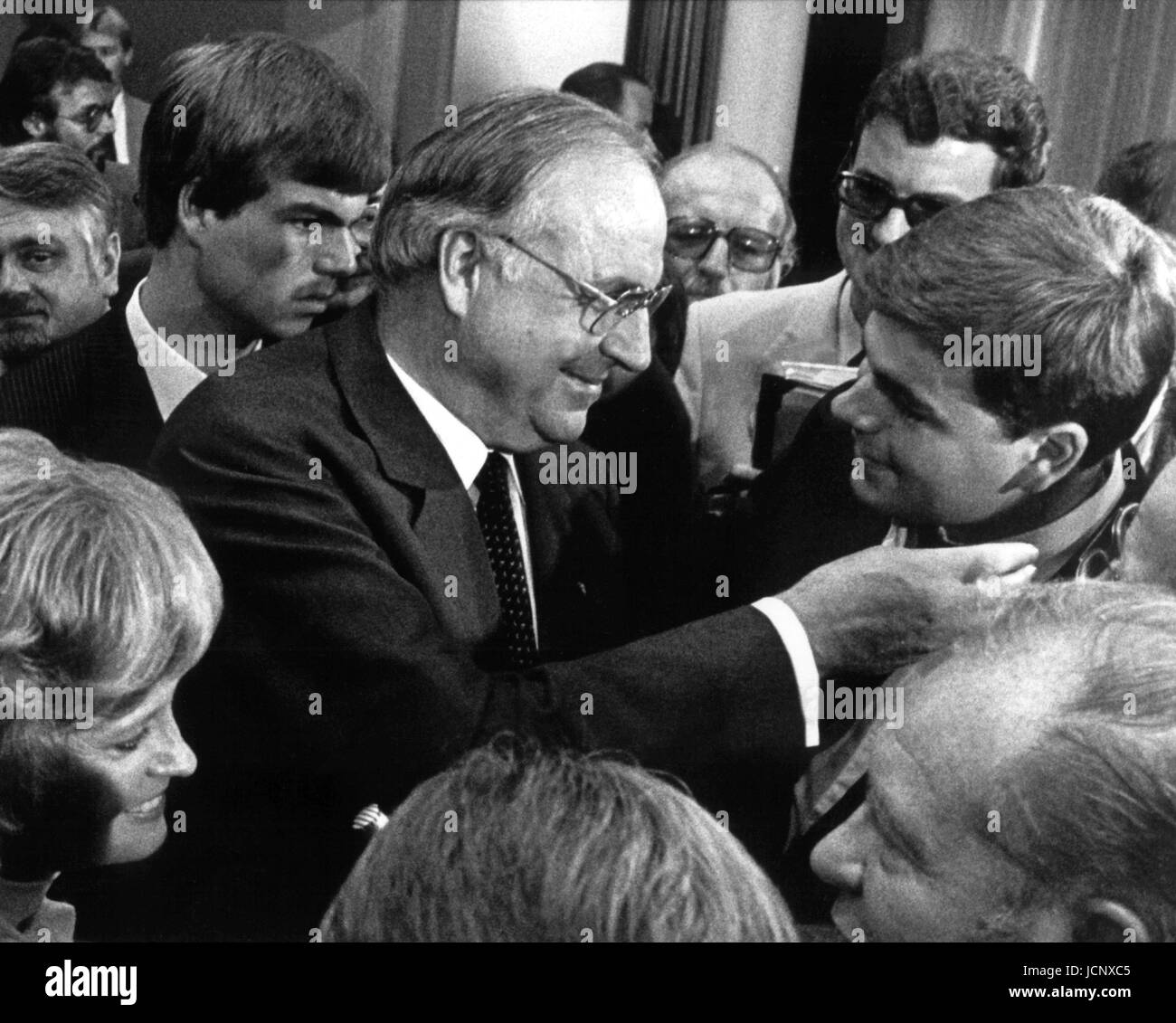 (dpa files) - Newly elected chancellor Helmut Kohl happily hugs his son Walter (R) in Bonn, West Germany, 1 October 1982. In the background: his son Peter (back L) and his wife Hannelore. That day, Chancellor Helmut Schmidt was deposed through a constructive vote of no-confidence in the Bundestag. 249 out of 495 members of parliament had voted for Kohl, seven more than necessary for an absolute majority. After 13 years in power the social liberal coalition had come to an end on 17 September 1982 when the four ministers Genscher, Baum, Ertl, and Count Lambsdorff resigned which led to the overth Stock Photo
