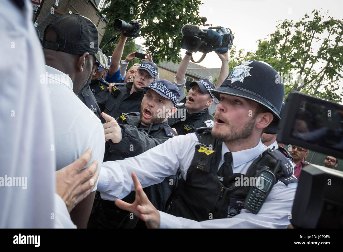 London, UK. 16th June, 2017. Angry scuffles with locals and police as ...