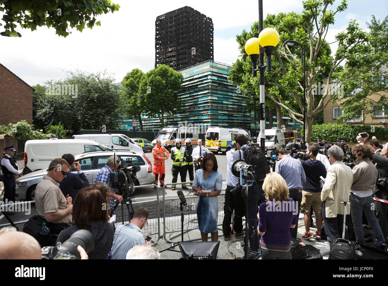 London, UK. 16th June, 2017. The Grenfell Tower Disaster, in West London. A 24 story residential building destroyed by fire. News media await latest news from the police and fire brigade. Stock Photo