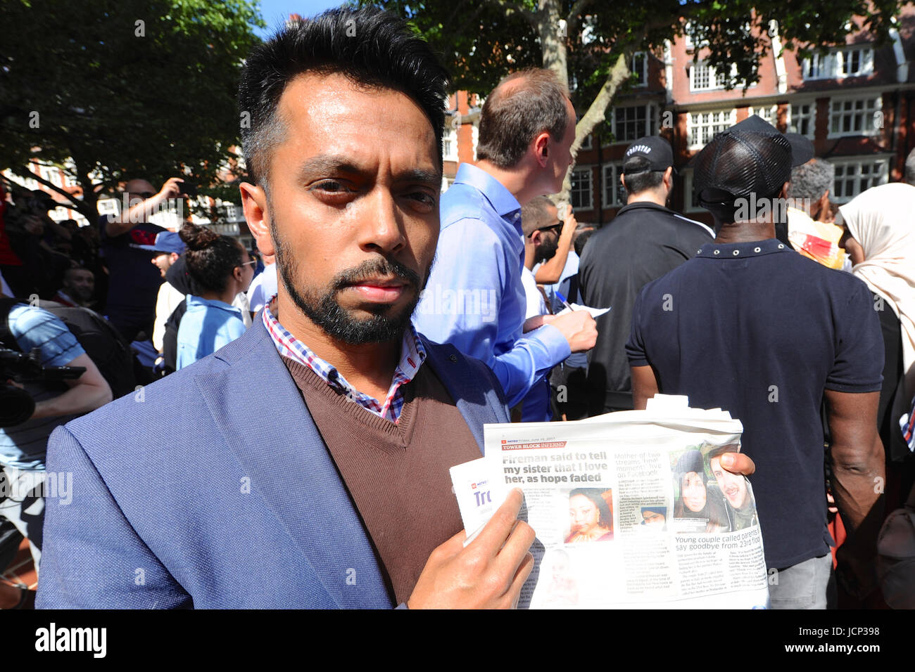 London, UK. 16th June, 2017. Mustafa al-Mansur, protest organiser and one of the people searching for friends who were caught up in the fire outside the offices of Kensington & Chelsea Council. Mr al-Mansur is holding a copy of Metro showing the picture of his friend Rania Ibrham who was caught in the fire with her two children and is still missing. Credit: Michael Preston/Alamy Live News Stock Photo