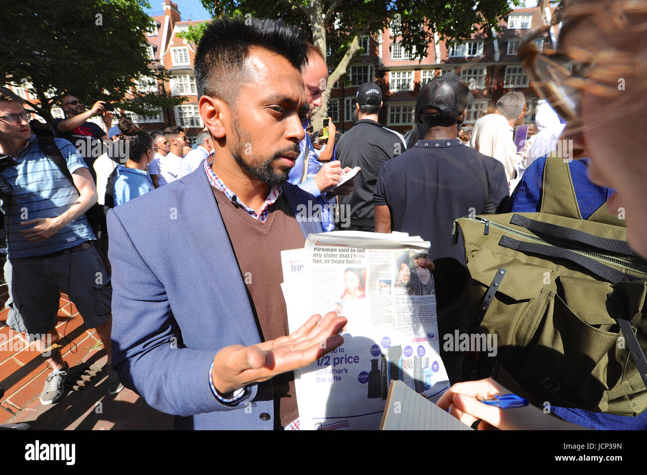 London, UK. 16th June, 2017. Mustafa al-Mansur, protest organiser and one of the people searching for friends who were caught up in the fire outside the offices of Kensington & Chelsea Council. Mr al-Mansur is holding a copy of Metro showing the picture of his friend Rania Ibrham who was caught in the fire with her two children and is still missing. Credit: Michael Preston/Alamy Live News Stock Photo