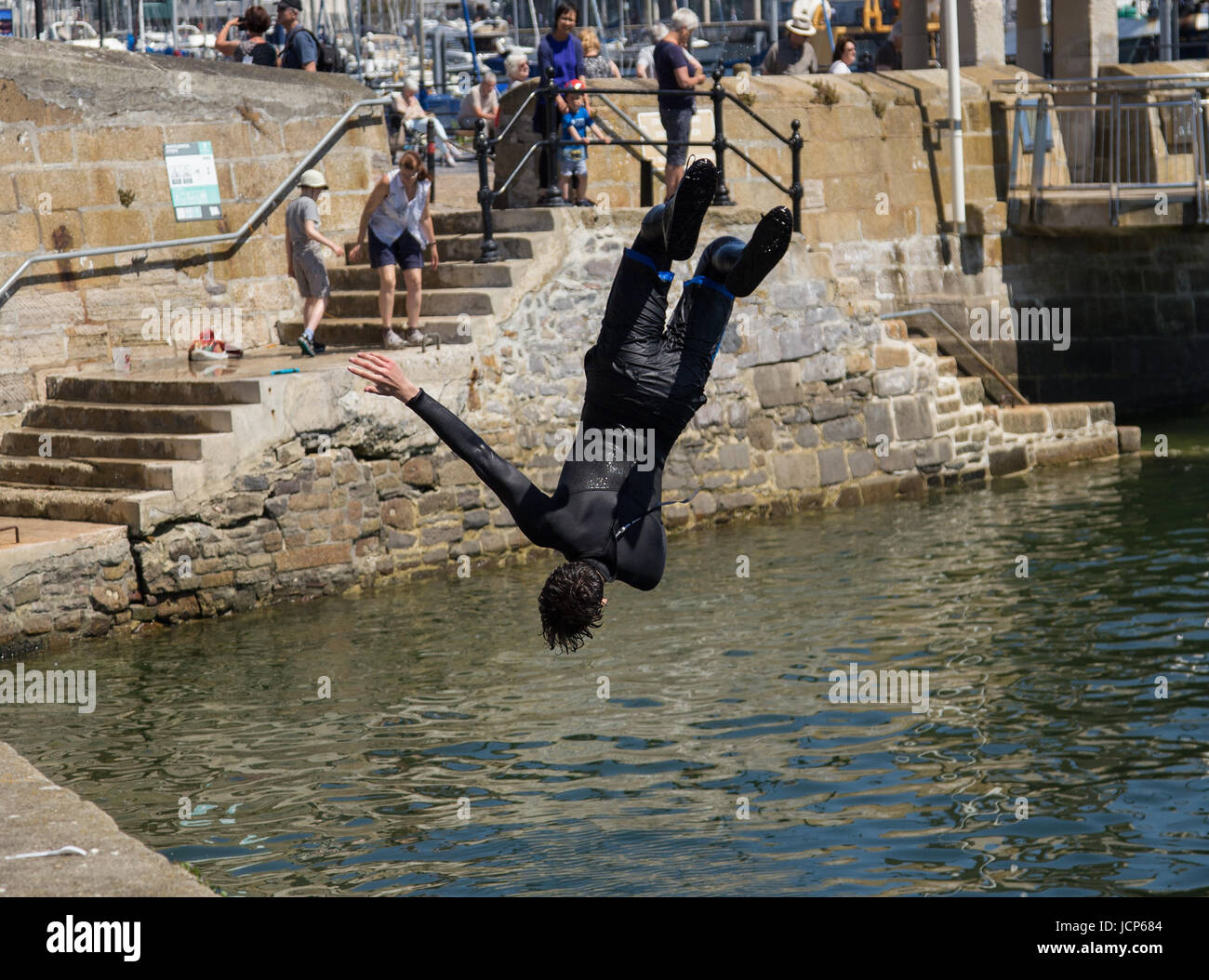 Plymouth, Devon, 17th June 17 - Young swimmers cool off by diving into the water at Barbican Wharves, Plymouth.  Credit: South West Photos/Alamy Live News Stock Photo