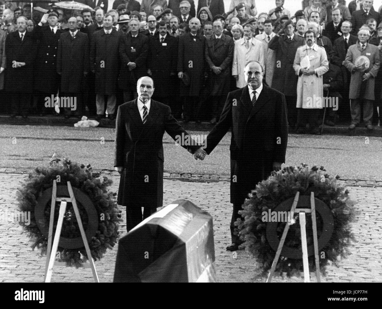 FILE - Then French President Francois Mitterrand (front L-R) and then German Chancellor Helmut Kohl hold each other's hands at the graves of Verdun, France, 22 September 1984. Helmut Kohl died at the age of 87 on 16 June 2017. Photo: Wolfgang Eilmes/dpa Stock Photo