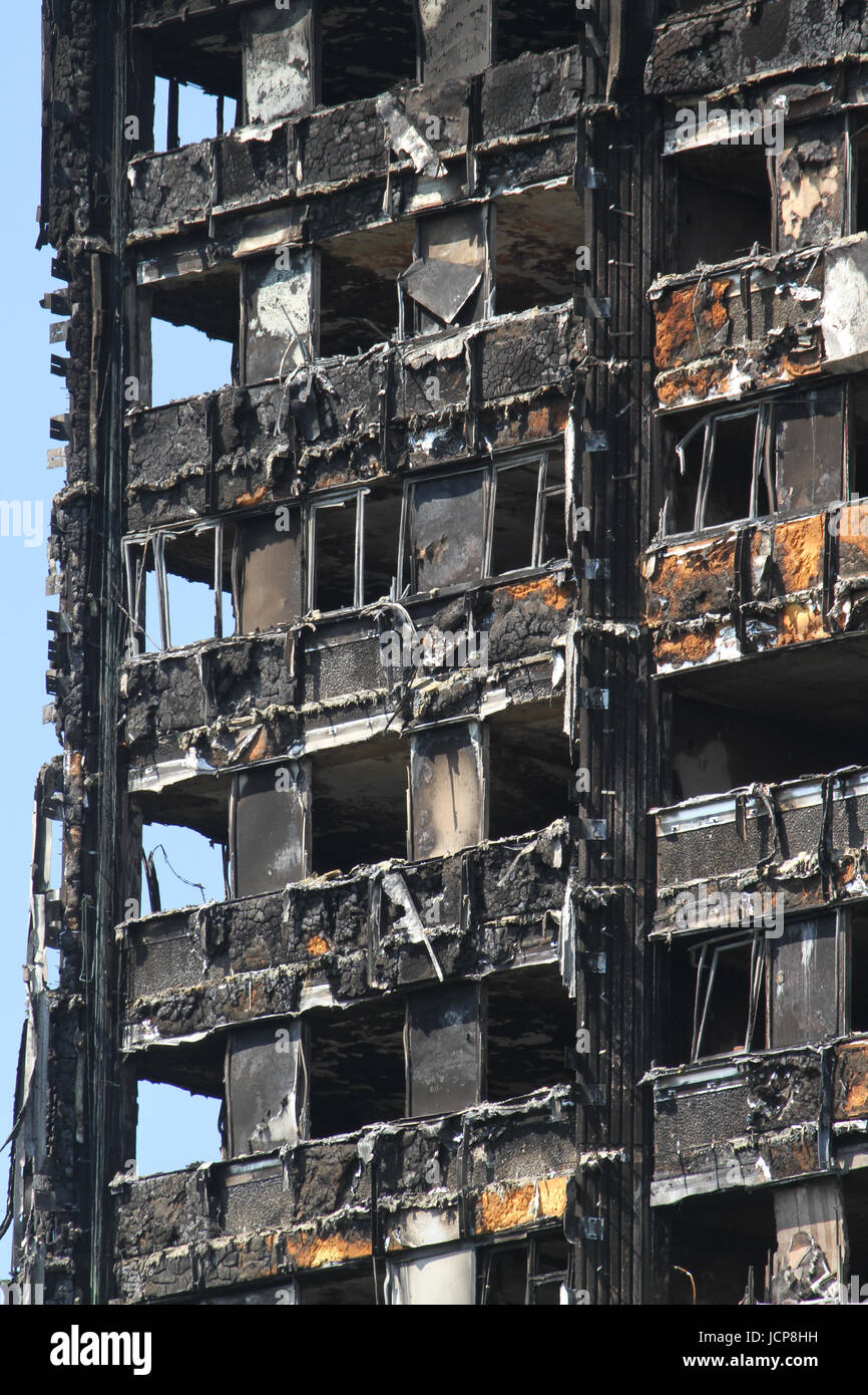 London, UK. 16th June, 2017. Burned out cladding seen on the charred remains of the 24-storey block Grenfell tower block located in the borough of Kensington and Chelsea where at least 30 people have been confirmed dead with about 70 missing and feared dead. Credit: david mbiyu/Alamy Live News Stock Photo
