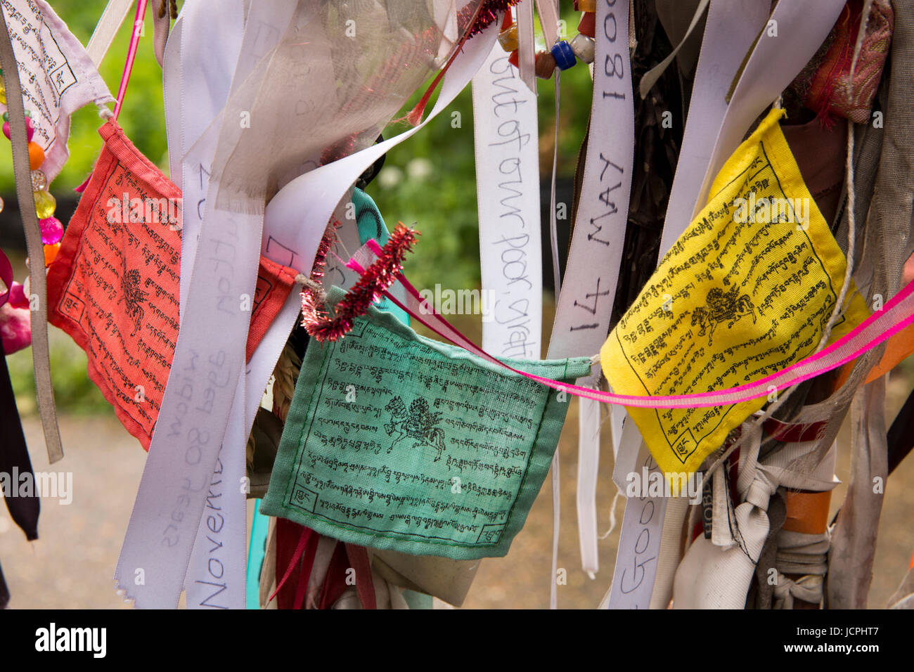 UK, London, Southwark, Redcross Way, Crossbones Garden, colourful Buddhist prayer flags tied to graveyard railings Stock Photo