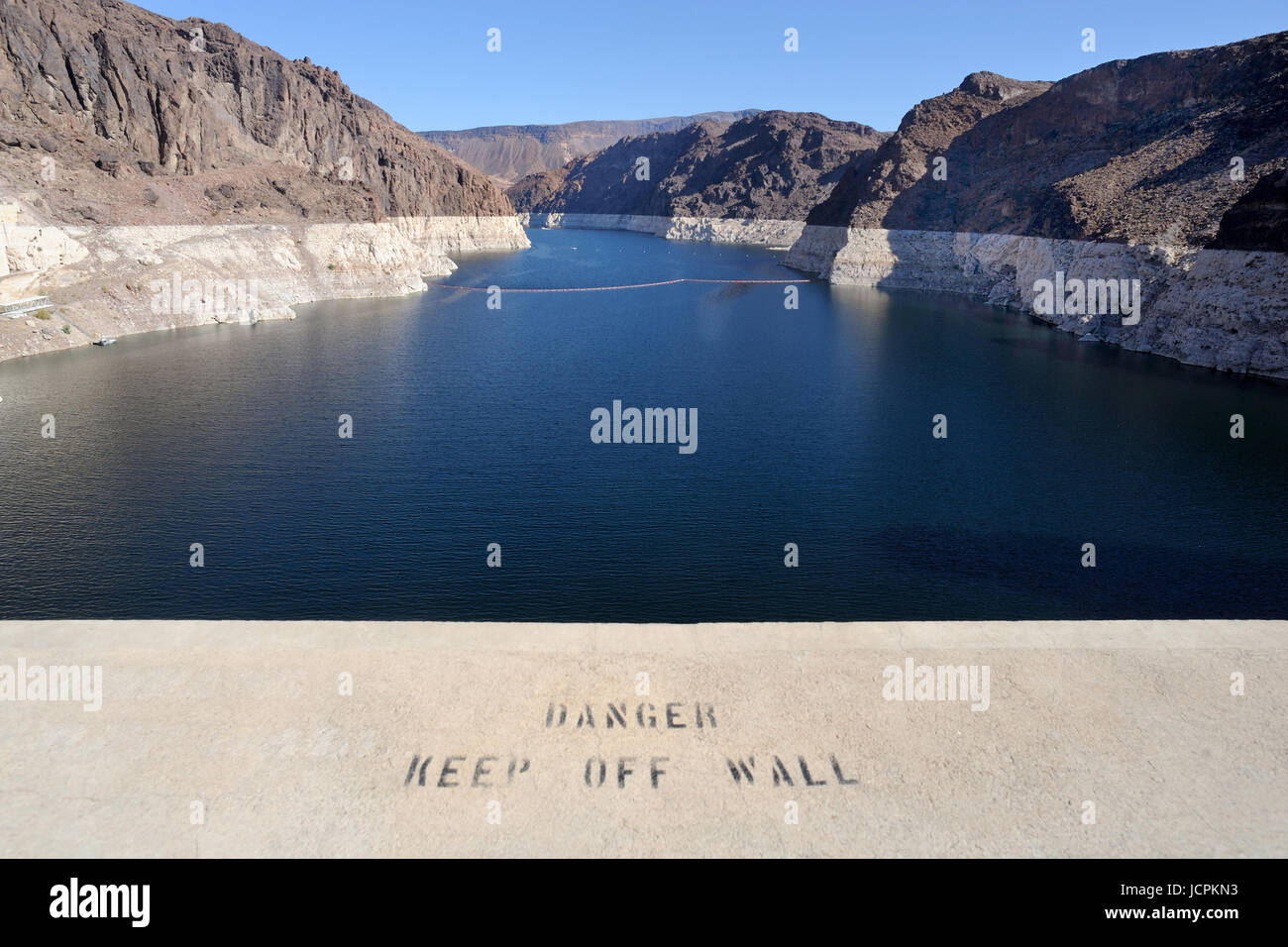Warning notice  on parapet at Lake Mead from the Hoover Dam Arizona/Nevada border USA Stock Photo
