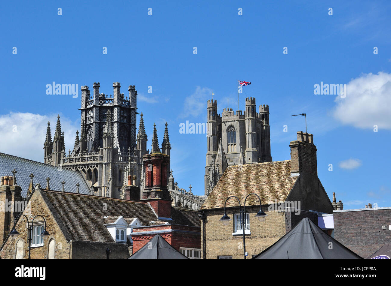 The towers of Ely Cathedral viewed from Market Place, Ely, Cambridgeshire, England, UK Stock Photo