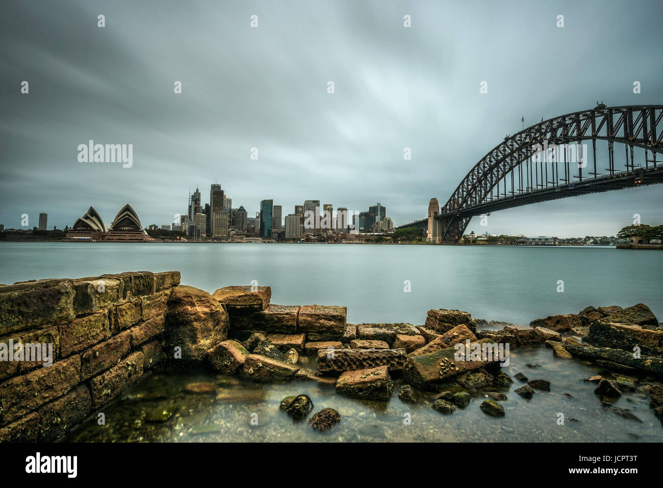Skyline of Sydney downtown  with Harbour Bridge, NSW, Australia. Long exposure. Stock Photo