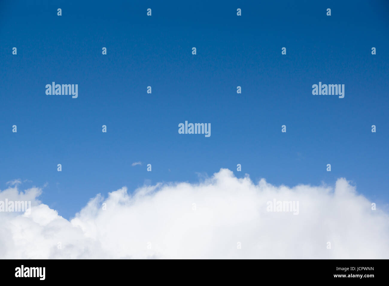 Blue sky with lots of white clouds Stock Photo - Alamy
