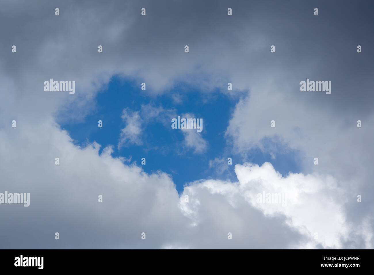 Blue sky with lots of white clouds Stock Photo - Alamy