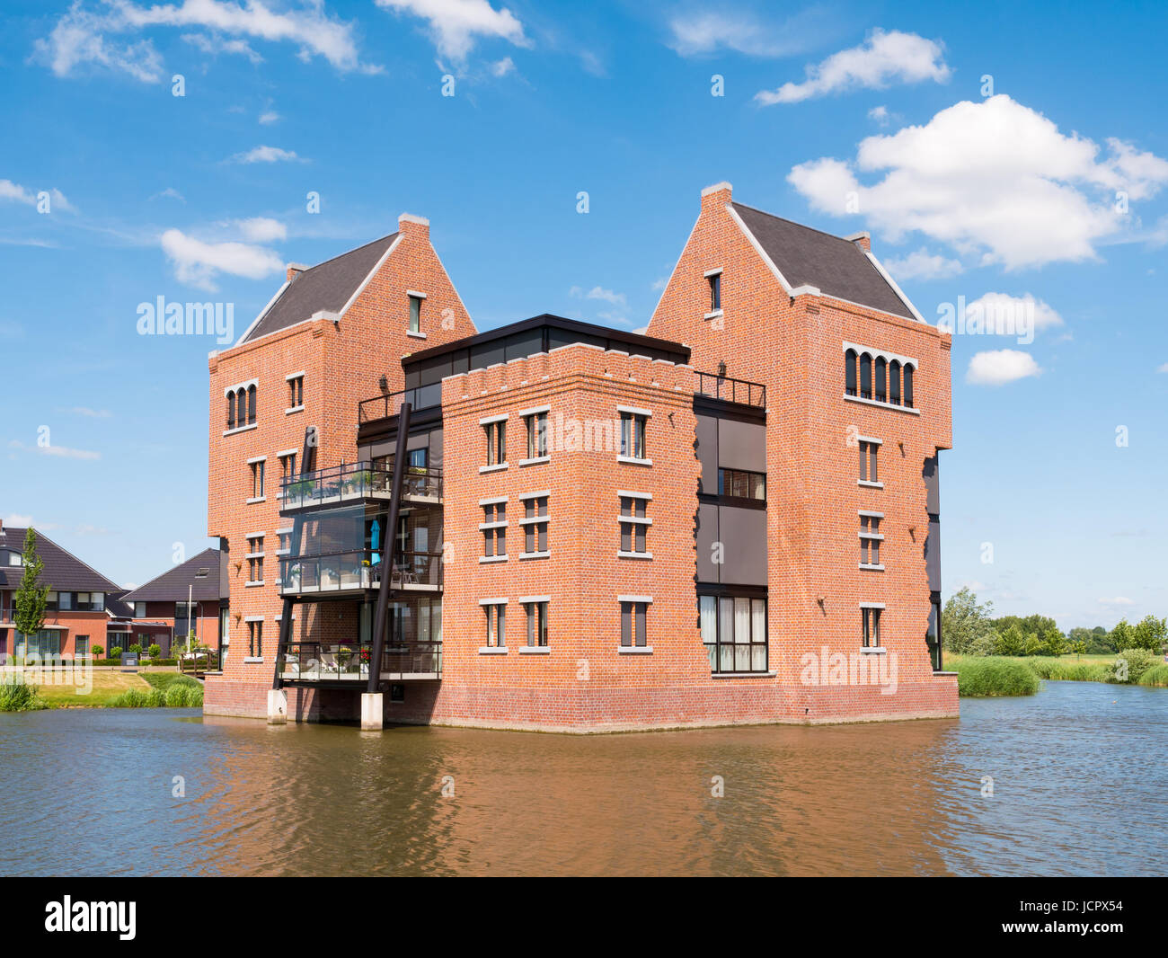 Modern waterfront apartment building in fortified town of Woudrichem, Brabant, Netherlands Stock Photo