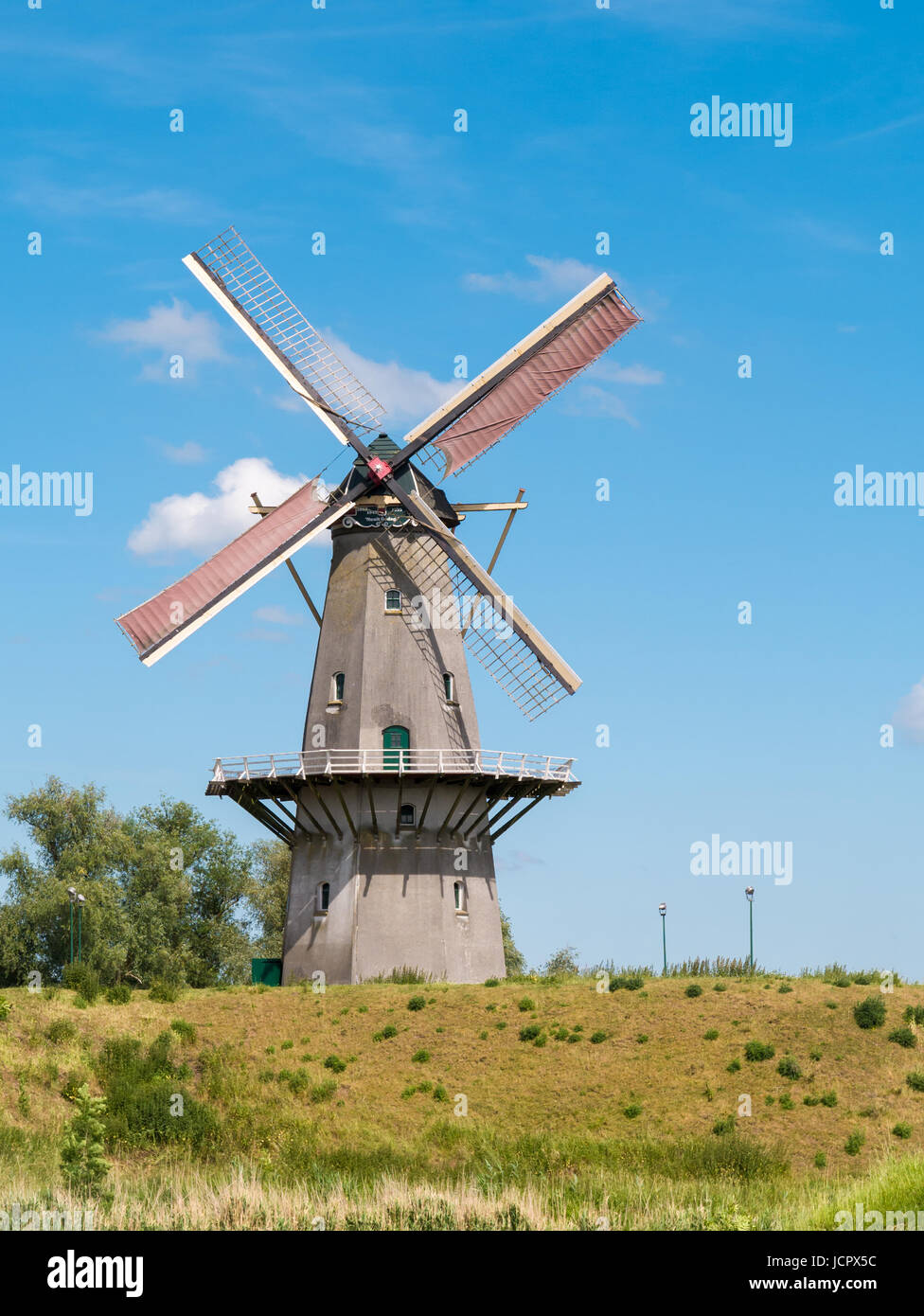 City wall and corn mill Nooit Gedagt in old fortified town of Woudrichem, Brabant, Netherlands Stock Photo