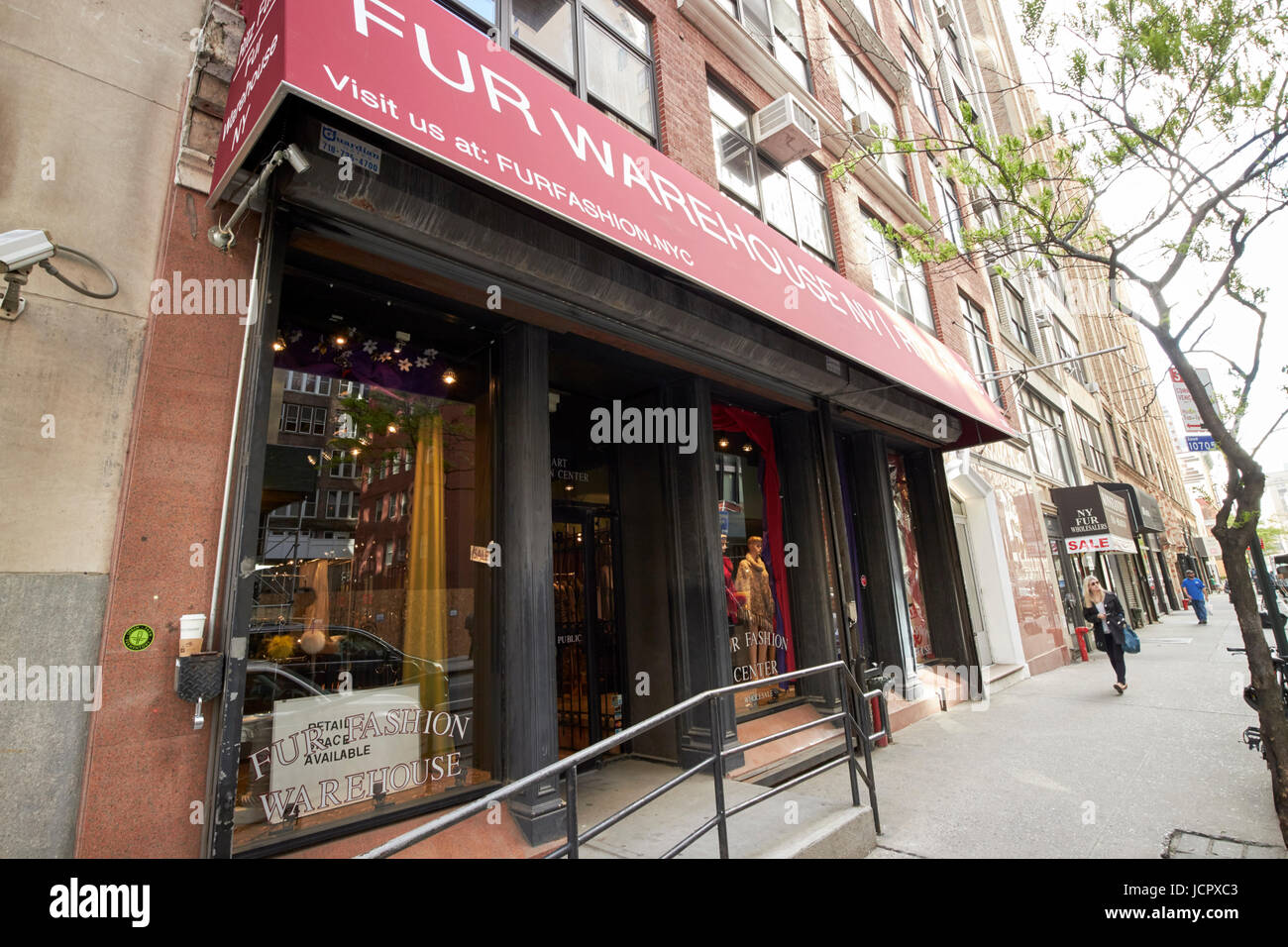 row of shops selling furs in fashion district New York City USA Stock Photo