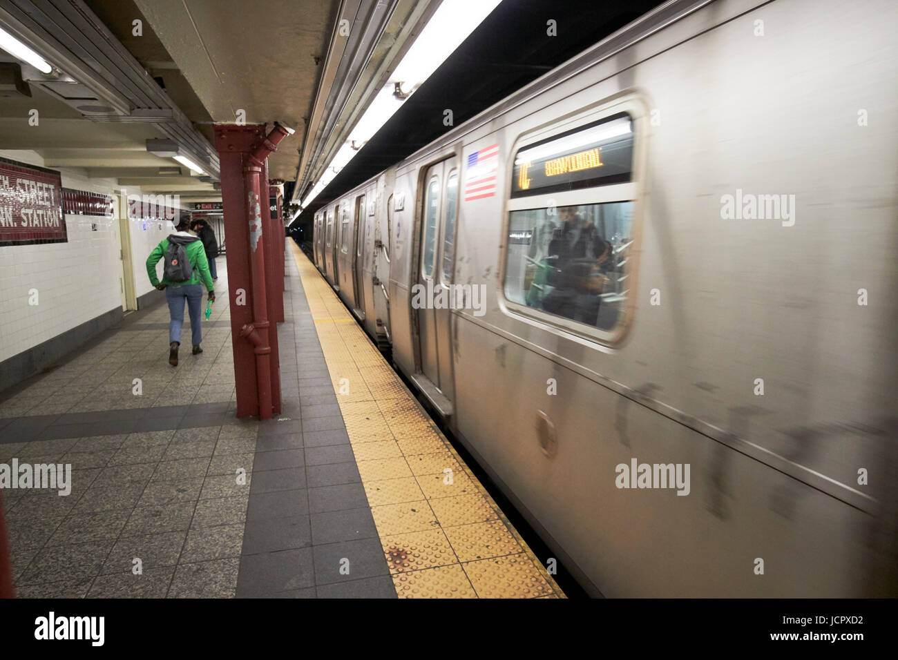 train leaving subway penn station platform New York City USA Stock Photo