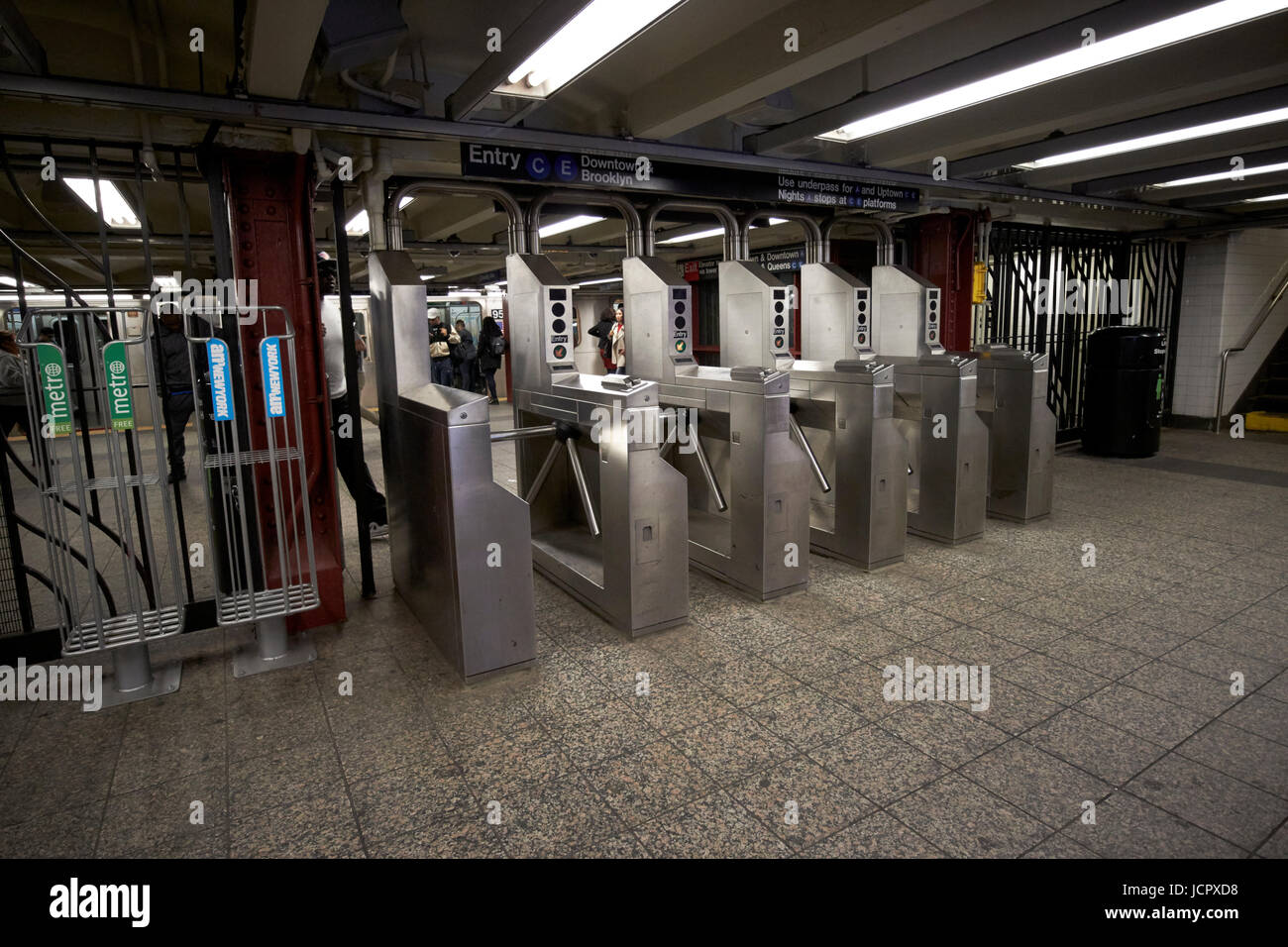 entrance gates at subway station platform New York City USA Stock Photo