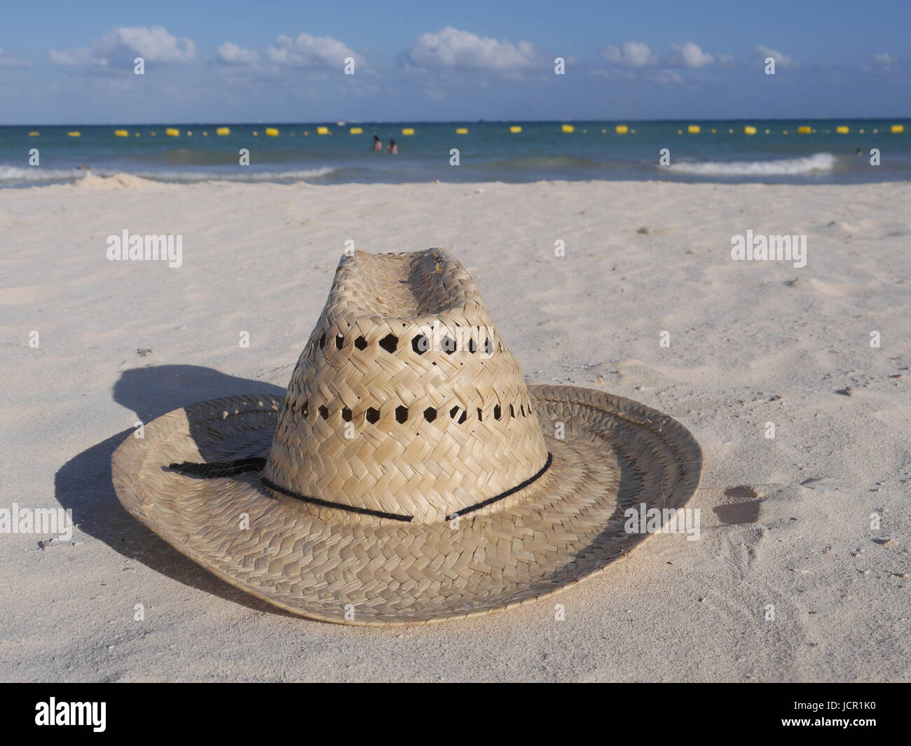 straw hat at the beach Stock Photo Alamy