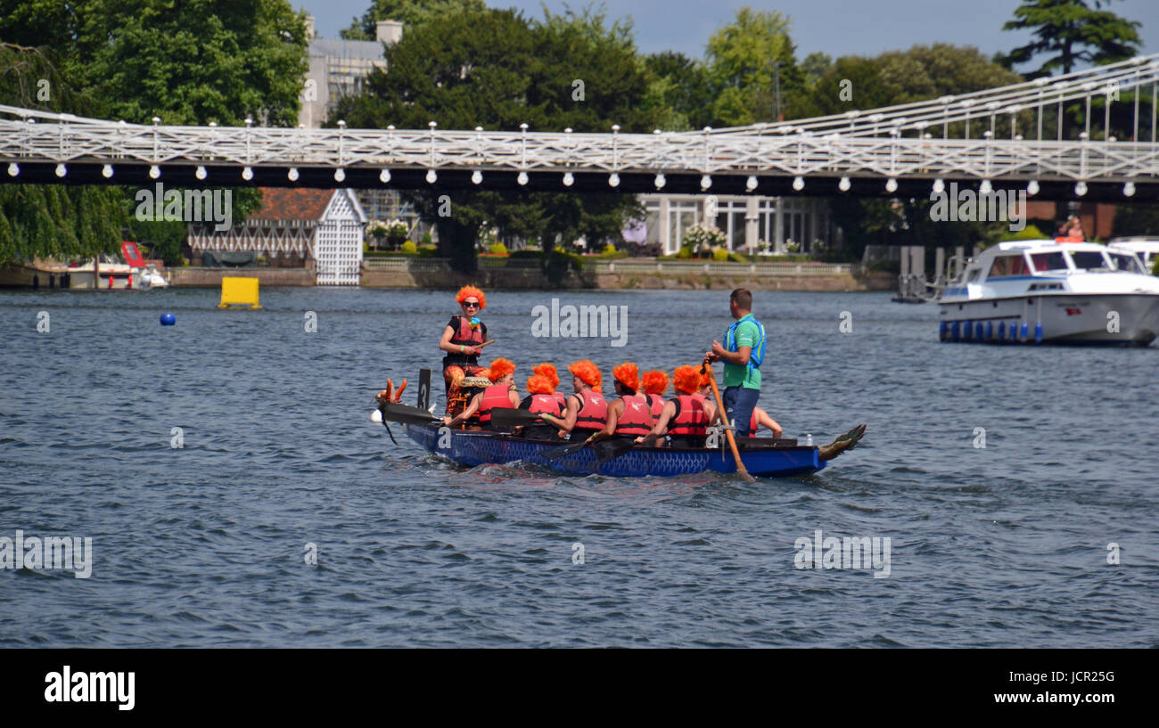 Team with firey orange hair at the Marlow dragon boat races on the River Thames, Marlow, Buckinghamshire, England, UK Stock Photo