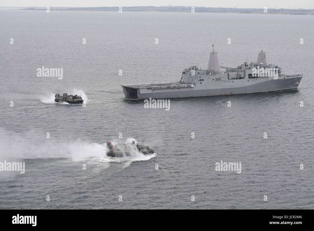 U.S. Navy landing craft disembark from the San Antonio-class amphibious transport dock ship USS Arlington for an amphibious beach landing during exercise BALTOPS June 8, 2017 in the Baltic Sea. Stock Photo
