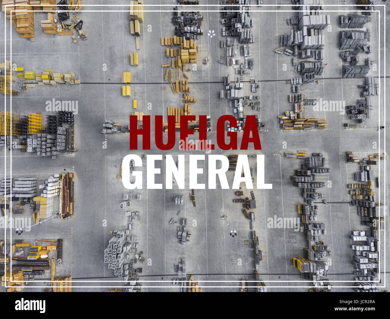 Word Huelga in spanish language. Industrial storage place, view from