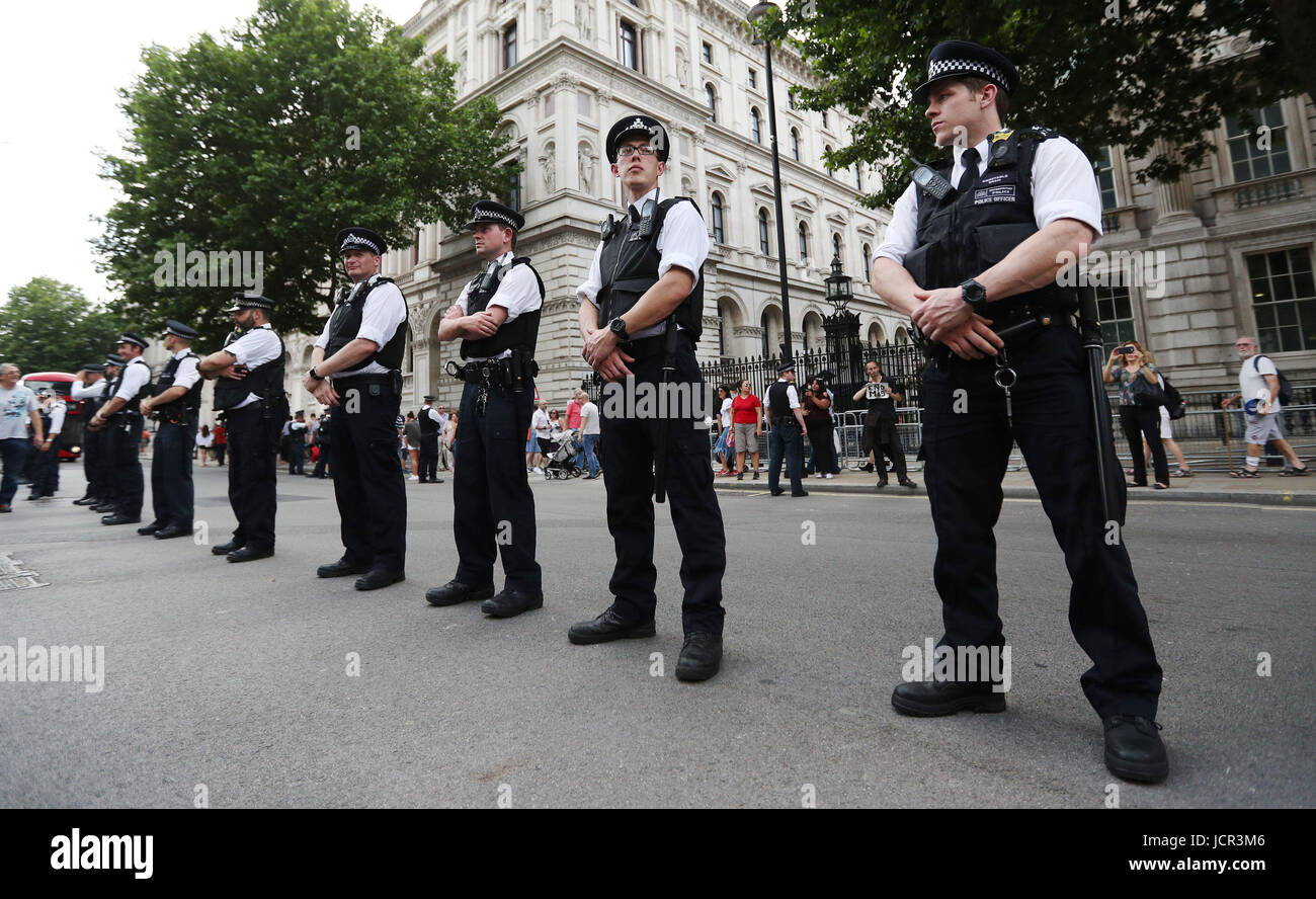 Police line Whitehall, London, as protesters demand answers and justice over the Grenfell Tower disaster. Stock Photo