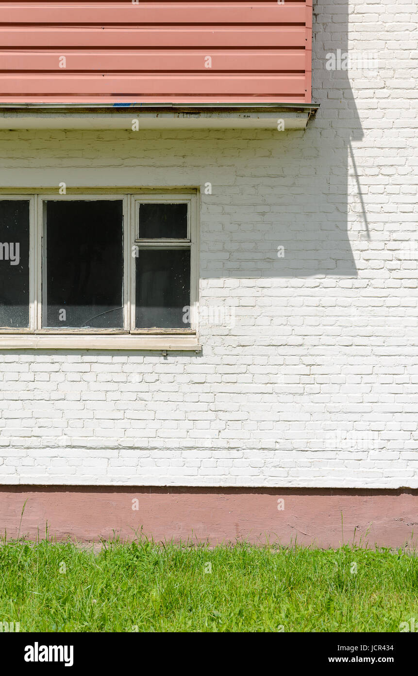 A white brick wall facade with window and balcony Stock Photo Alamy