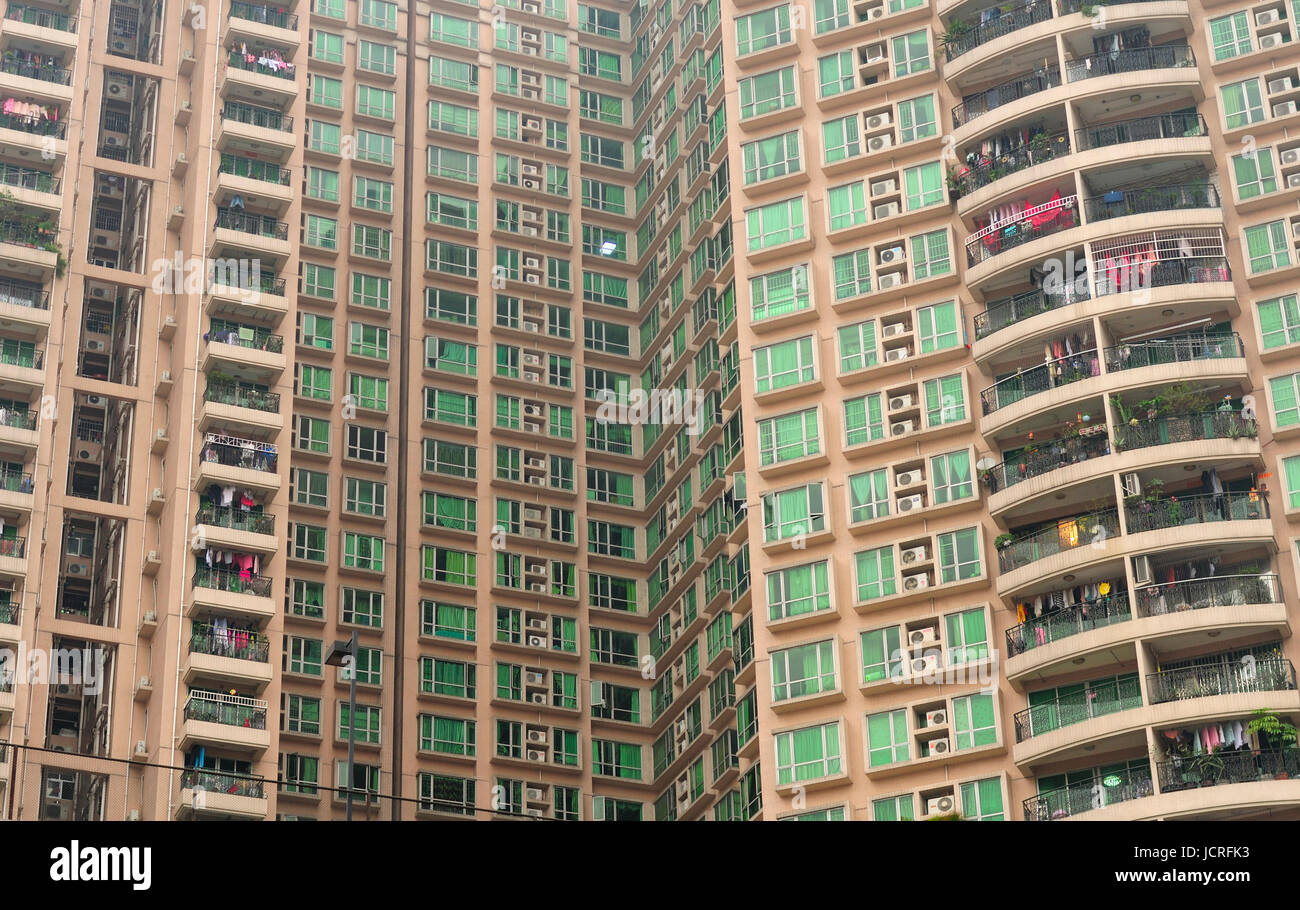 A high rise apartment building on ShangXia Jiu Pedestrian Street in the Xiguan district in the city of Guangzhou China on an overcast day in Guangdong Stock Photo
