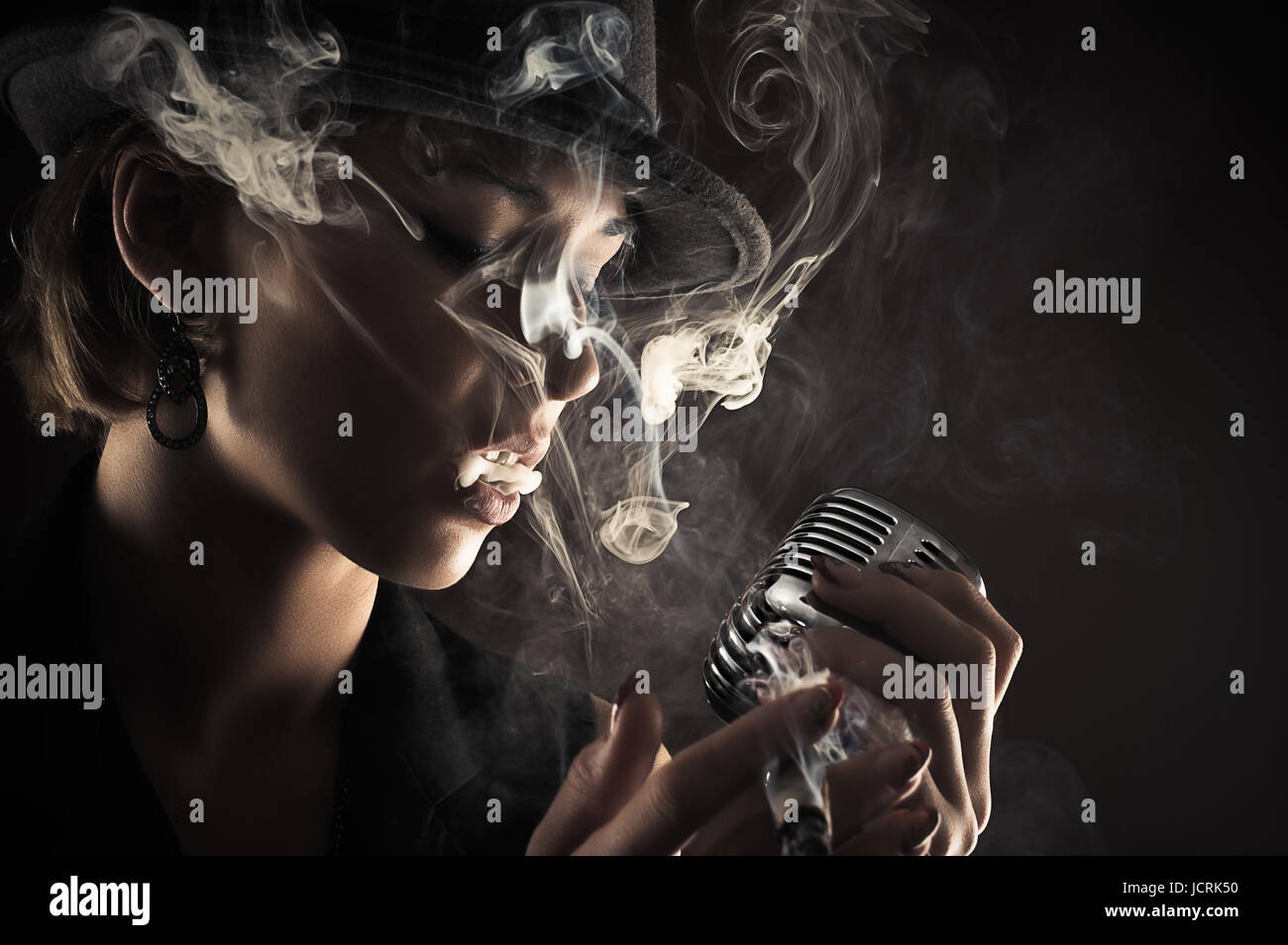 singer with retro microphone and cigarette smoke Stock Photo - Alamy