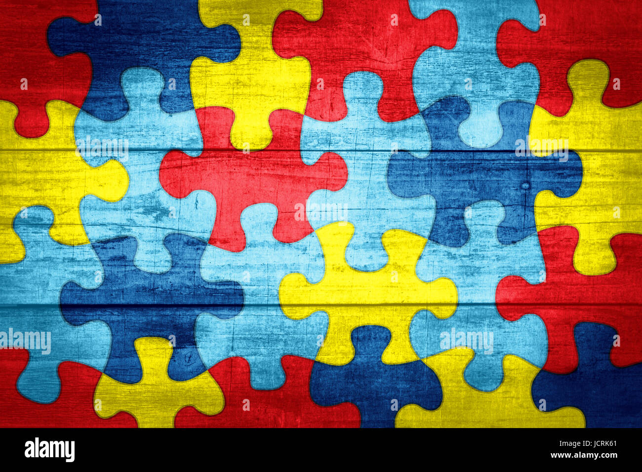 A colorful autism awareness puzzle background with wood texture  illustration Stock Photo - Alamy