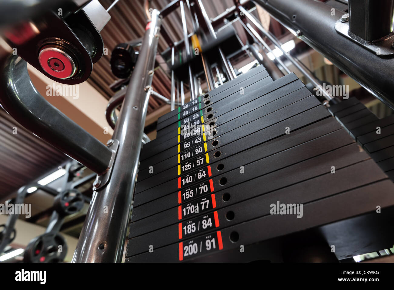 Weights in gym machine Stock Photo Alamy