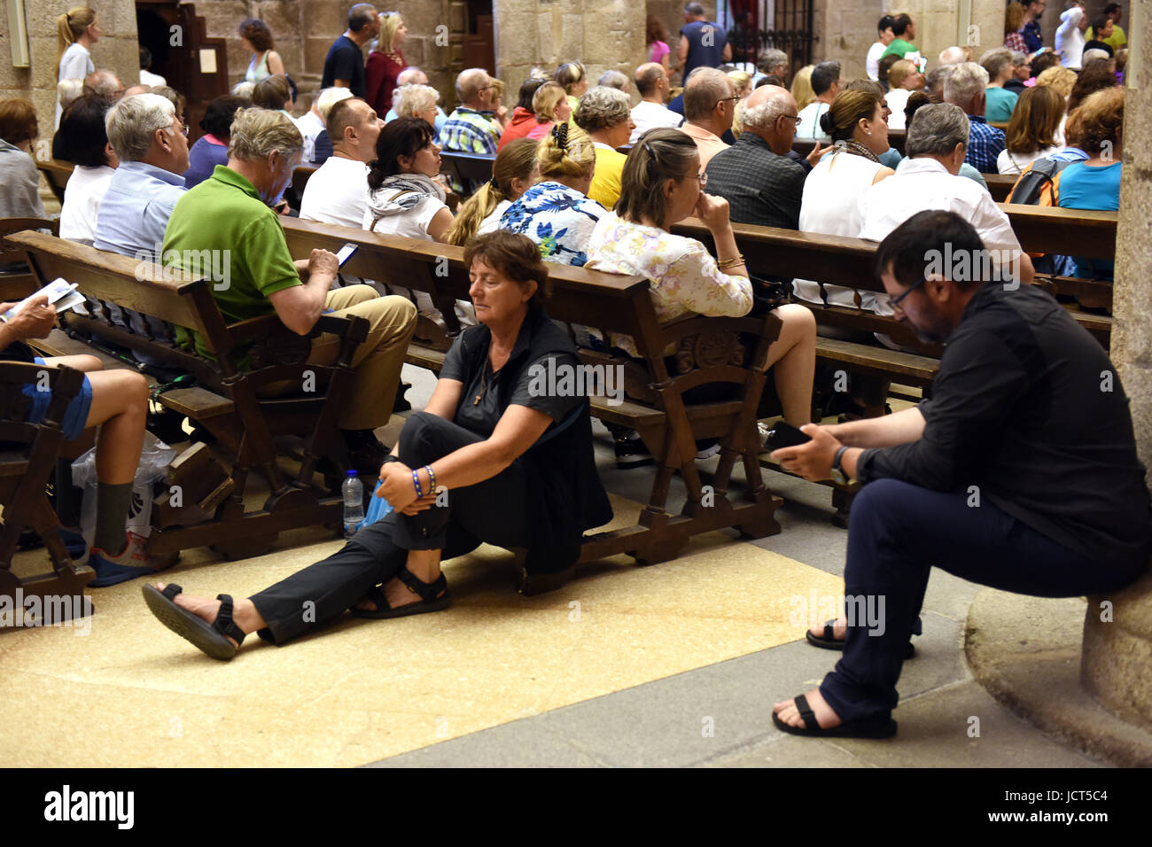 Christian worshippers and visitors waiting for Pilgrims Mass to start at Cathedral of Santiago de Compostela in Spain. Stock Photo
