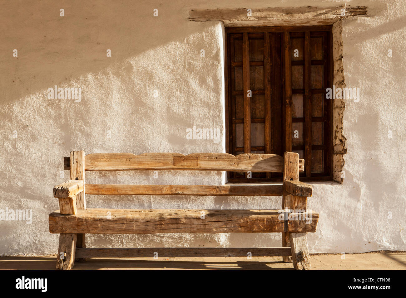 bench and window, Casa De La Guerra, Santa Barbara, California Stock Photo