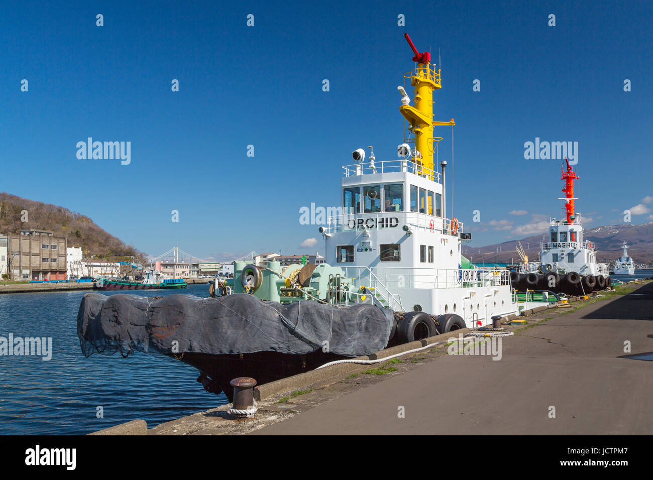 Tugboats docked in Muroran, Hokkaido Prefecture, Japan. Stock Photo