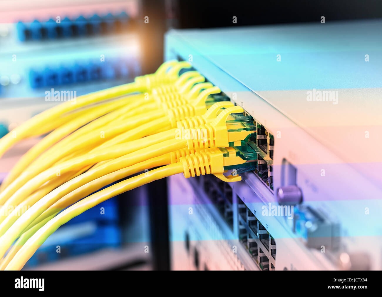 network cable connecting on network core switch close up Stock Photo