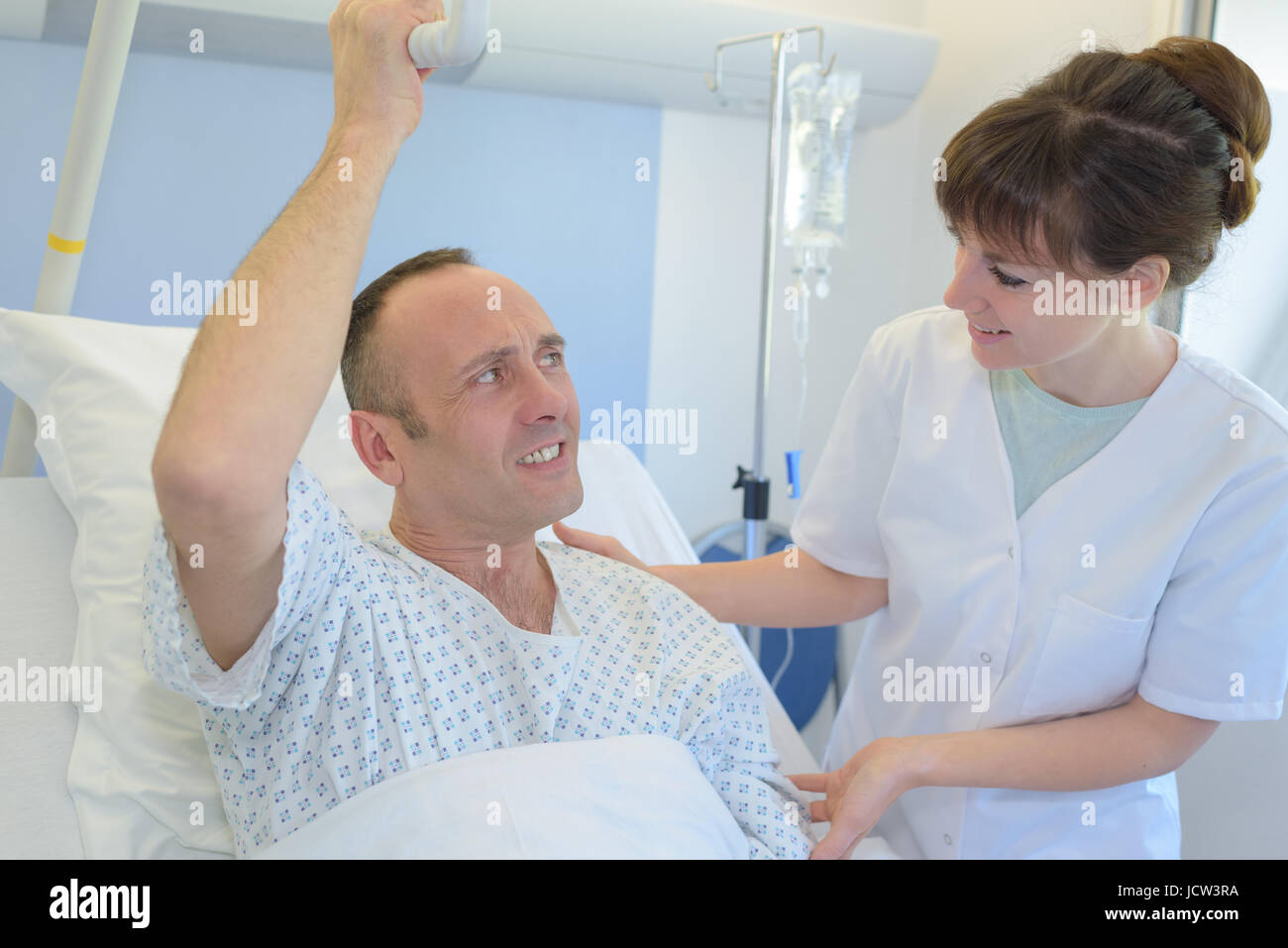 female nurse talking about medical report to patient Stock Photo - Alamy