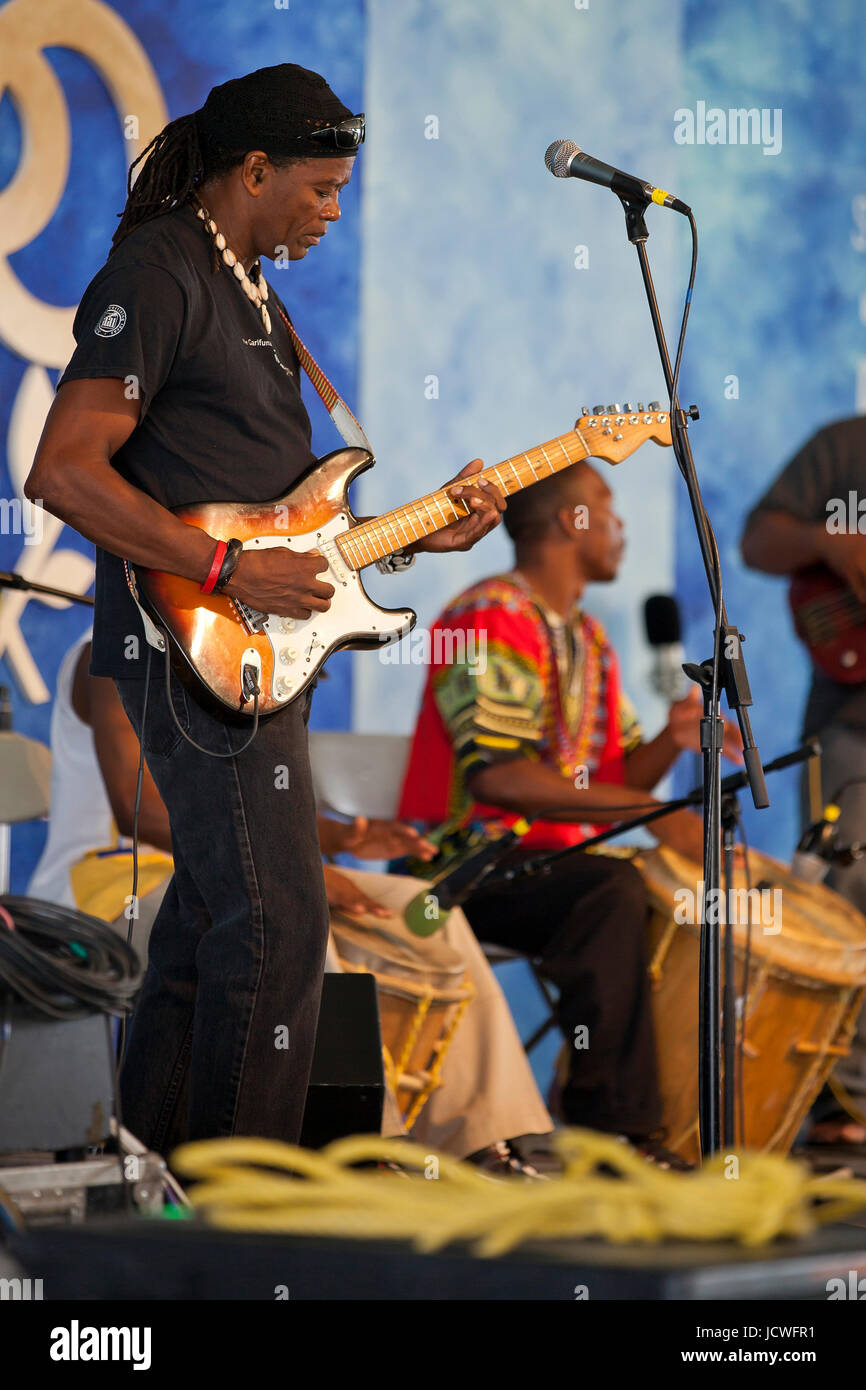 African-American soul musician player playing electric guitar on stage - USA Stock Photo
