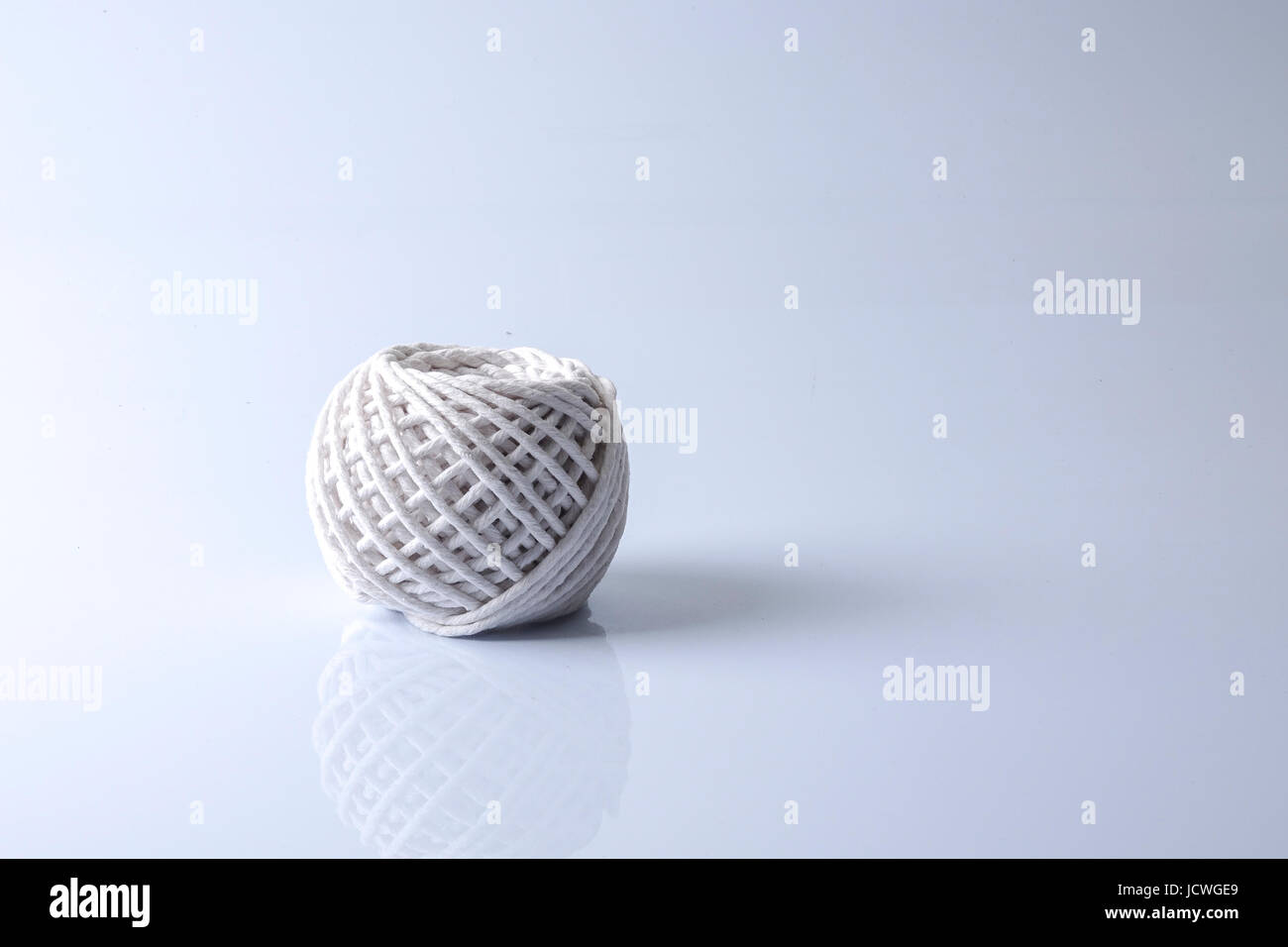 Thread spool isolated on white Stock Photo - Alamy