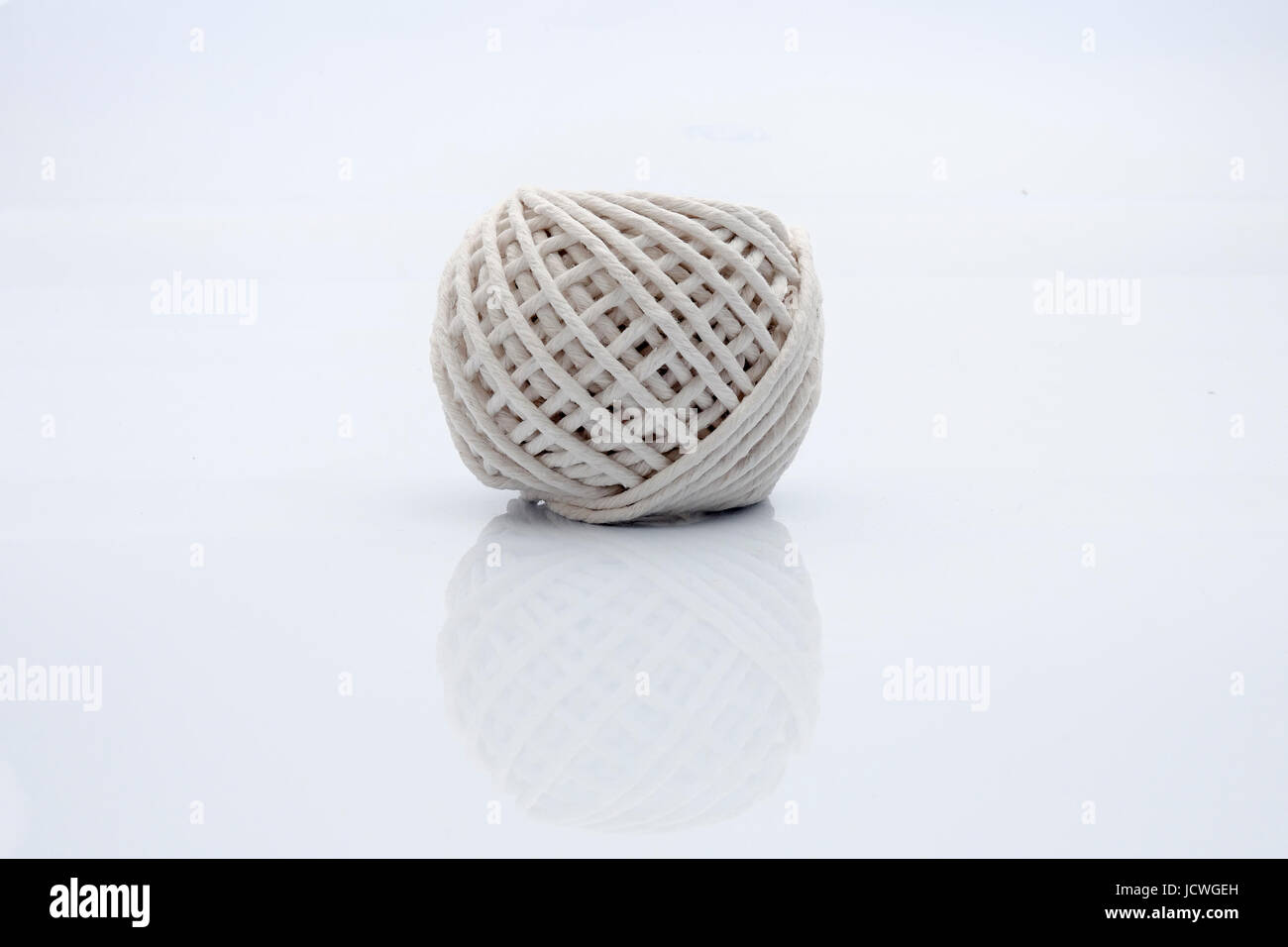Thread spool isolated on white Stock Photo - Alamy